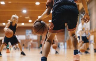 young athlete dribbling basketball