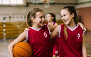 2 girls basketball players teammates