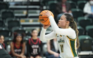 Jasmine Gayles shooting a basketball for University of San Francisco