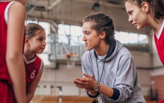 girls basketball coach and players