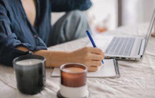 person at a computer writing