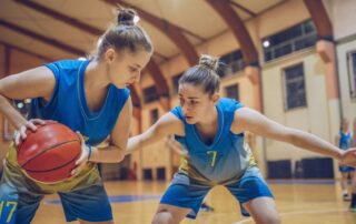 Girls basketball players in blue uniforms