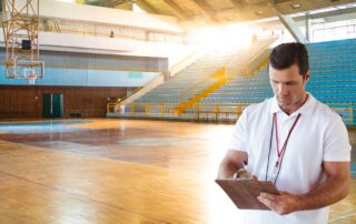 Basketball coach looking at practice plan