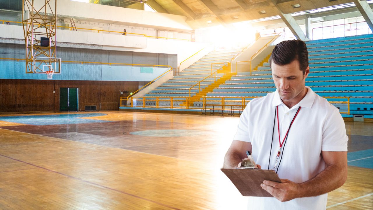 Basketball coach looking at practice plan