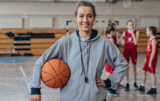 young woman basketball coach