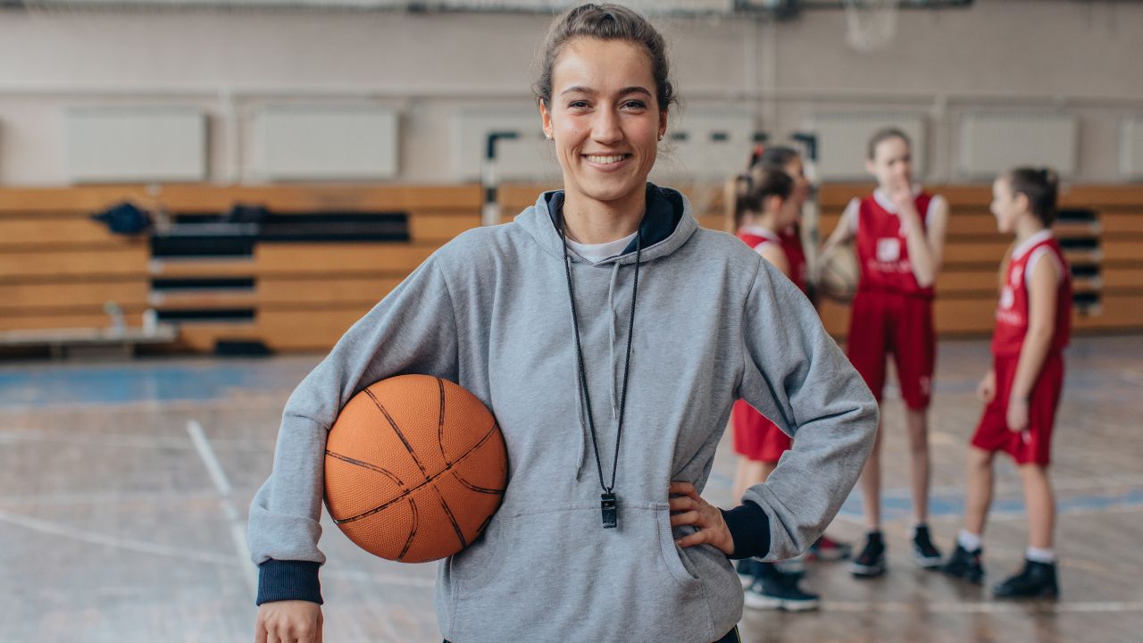 young woman basketball coach